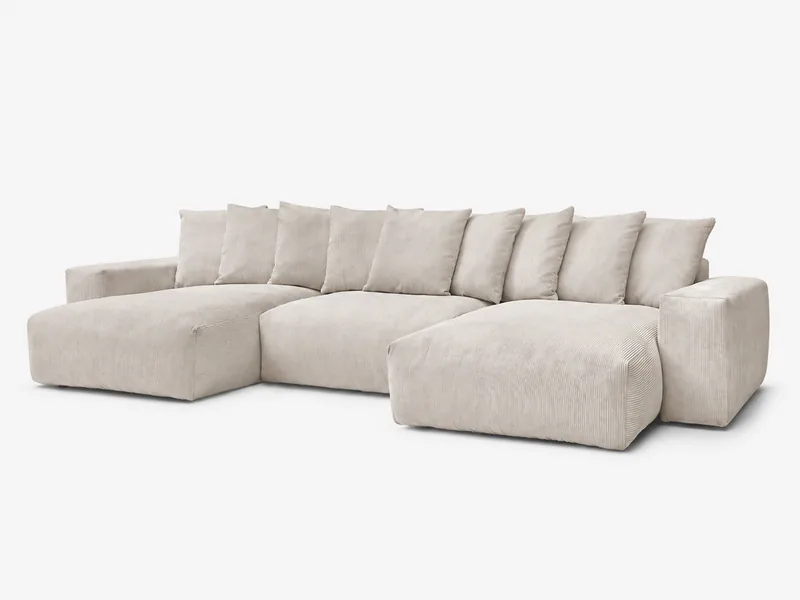 Beige Wohnlandschaft mit zwei Liegeflächen und losen Rückenkissen